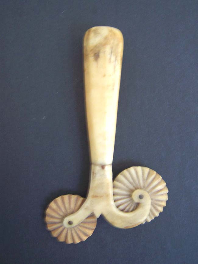 A 19th century ANTIQUE Whale Ivory and Whalebone Double Wheel Pie Crimper